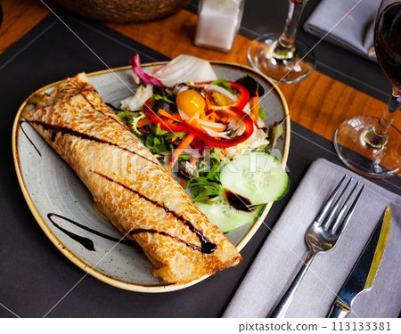Crepes with vegetable salad and balsamic sauce 113133381