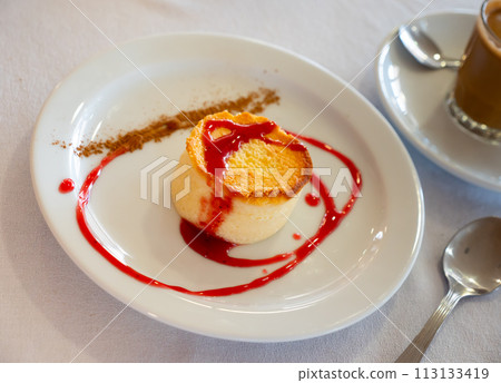 Tender creamy mousse cheesecake with currant sauce 113133419