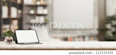 A digital tablet white-screen mockup on a white marble tabletop in a contemporary office room. 113133705
