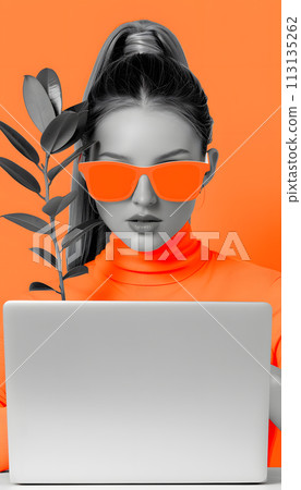 A woman with orange sunglasses is using a laptop computer A woman with orange sunglasses is using a laptop computer 113135262