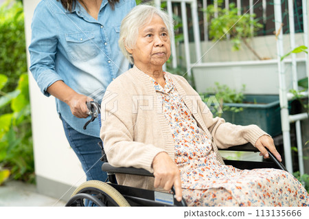 Caregiver help and care Asian senior woman patient sitting on wheelchair to ramp in nursing hospital, healthy strong medical. 113135666