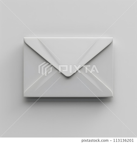 A white rectangle envelope rests on a white surface 113136201