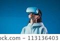 Woman in VR glasses. 113136403