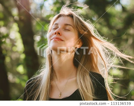 Portrait of a young woman with closed eyes, enjoying the warmth and tranquility of nature, embodying peace and relaxation Portrait of a young woman with closed eyes, enjoying the warmth and tranquility of nature, embodying peace and relaxation 113136539