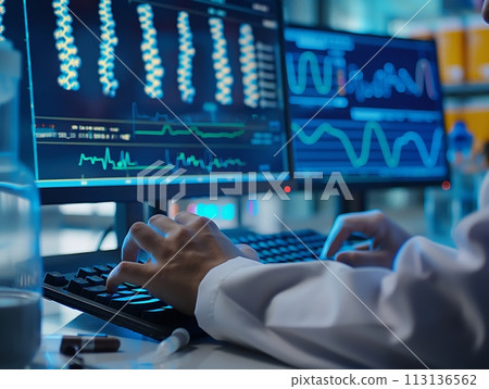 A medical scientist types, analyzing complex genetic data across multiple computer screens A medical scientist types, analyzing complex genetic data across multiple computer screens 113136562