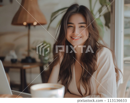 Portrait of a smiling young woman in a cozy setting 113136633