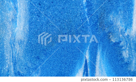 Glitter texture. Shiny particles. Defocused blue white color sparkling shimmering grain paint abstract art free space background. 113136786