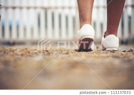 Sport sneakers footwear young woman knelt down do up shoelaces. Ready running shoes in sport exercise jogging person. Close up hands tie up runner shoelaces in fitness gym healthy person lifestyle. Sport sneakers footwear young woman knelt down do up shoelaces. Ready running shoes in sport exercise jogging person. Close up hands tie up runner shoelaces in fitness gym healthy person lifestyle. 113137033