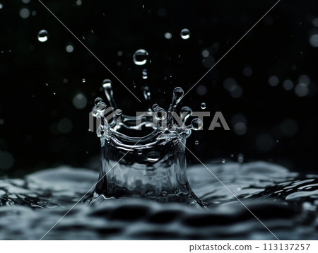 A stunning capture of water drops colliding in mid-air, showcasing dynamic fluid motion A stunning capture of water drops colliding in mid-air, showcasing dynamic fluid motion 113137257