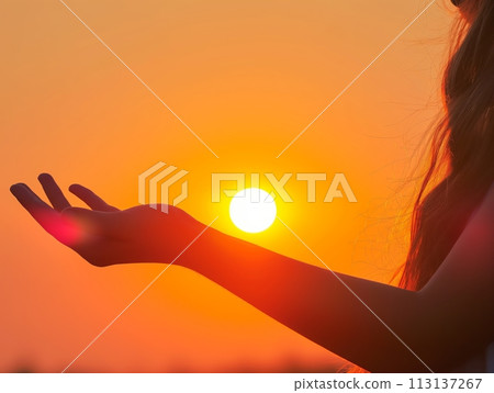 Hand silhouetted against a stunning sunset, capturing the beauty of the moment Hand silhouetted against a stunning sunset, capturing the beauty of the moment 113137267