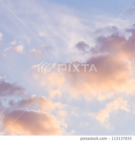Background of blue sky with pale pink clouds at sunset Background of blue sky with pale pink clouds at sunset 113137835
