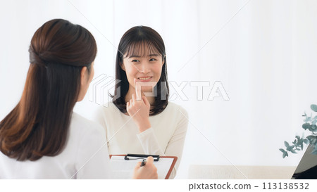 Female patient undergoing examination 113138532