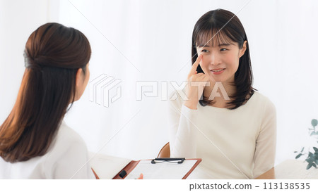 Female patient undergoing examination 113138535