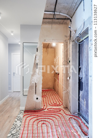 Old apartment with brick walls and new renovated flat with doors, mirror and stylish design in white tones. Inferior of apartment before and after renovation. 113138627