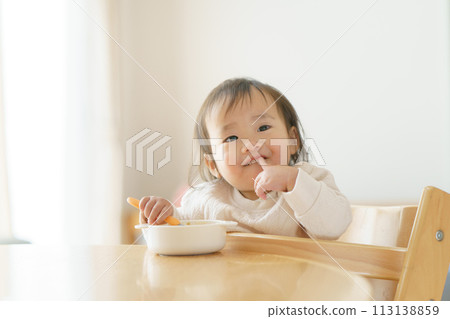 Baby eating baby food 113138859