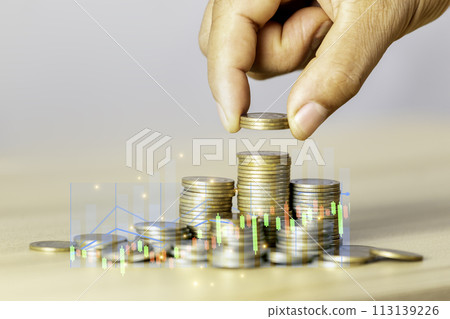 Businessman puts a coin on a pile of gold coins. Investment finance business idea. Business growing concept to success. Business success concept wealth stock investment. Technology grow concept. 113139226