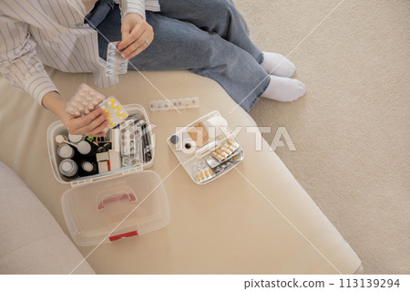 Female hands blister pills pack first kit aid storage organization. Vitamin, painkiller, cure supply 113139294