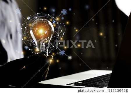 Business People touch Light bulb.Concept of Ideas for Success. Concept with Innovation Invention. Success Starting from a new idea to innovative technology based on data from the Internet, big data.. 113139438