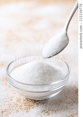Granulated sugar on a glass plate 113139778