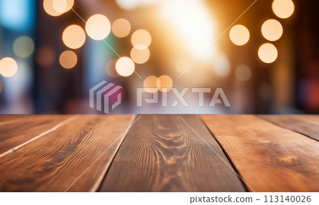 Empty wooden table top with lights bokeh on blur restaurant background. wooden table for product placement or montage with focus table top. Close up of wooden table in cafe 113140026