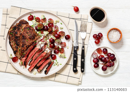 fried beef steak with salad of grape, cheese fried beef steak with salad of grape, cheese 113140083