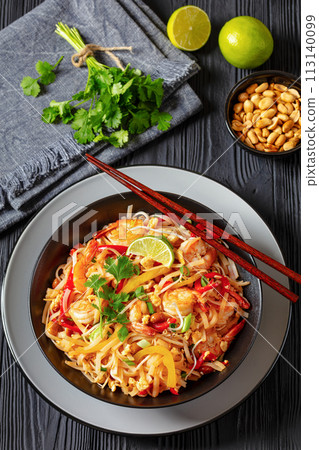 pad thai with shrimps, peanuts, eggs, bean sprouts 113140099