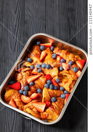 berry croissant casserole in baking dish, top view 113140447