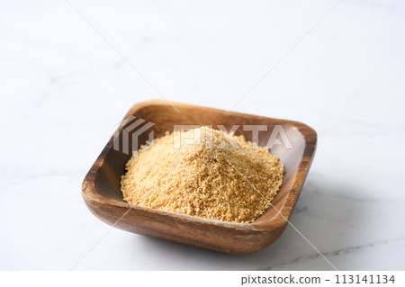 Beet sugar served on a wooden plate 113141134