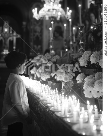 Sacred milestone: capturing the essence of first communion in a tender and symbolic portrayal, where young believers embrace the solemnity and spirituality of this significant rite 113141696