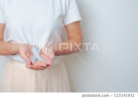 Brain Cancer Awareness May month, woman with grey color Ribbon for supporting life people. Healthcare and World cancer day concept Brain Cancer Awareness May month, woman with grey color Ribbon for supporting life people. Healthcare and World cancer day concept 113141932