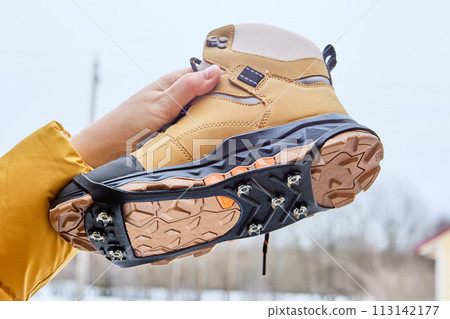 Ice grips for walking on icy or slippery surfaces, traction tread outsole and cleats simultaneously contact walking surface, providing superior grip on ice, snow, and pavement. 113142177