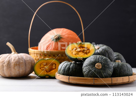 Various pumpkins with black background, Vegetable in autumn season 113143024