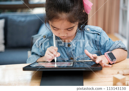 A young girl is playing with a remote control a robot A young girl is playing with a remote control a robot 113143130