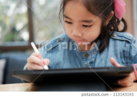 A young girl is playing with a remote control a robot A young girl is playing with a remote control a robot 113143143