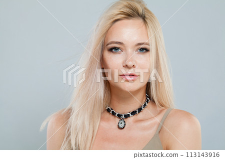 Celebrity fashion female model with long blonde hairstyle and shiny fresh skin  113143916