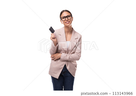 pretty 30 year old business woman with black hair wearing a beige jacket holding a plastic card with pretty 30 year old business woman with black hair wearing a beige jacket holding a plastic card with 113143966