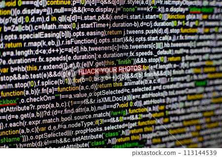 Macro photo of computer screen with program source code and highlighted HIJACK YOUR PHOTOS inscription in the middle. Script on the screen with virus in it. Cyber security concept. Technology 113144539