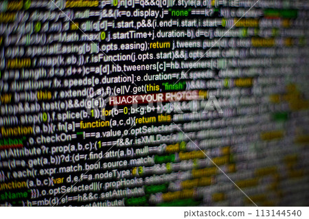 Macro photo of computer screen with program source code and highlighted HIJACK YOUR PHOTOS inscription in the middle. Script on the screen with virus in it. Cyber security concept. Technology 113144540