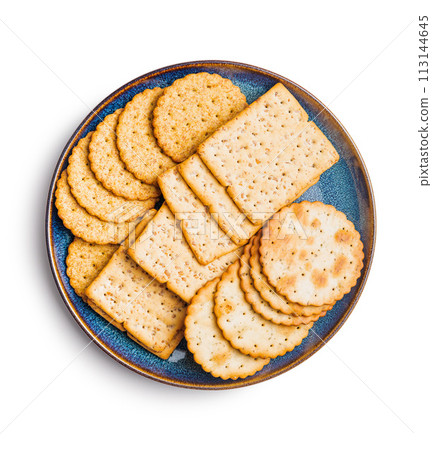 Salted crackers isolated on plate on white background. 113144645
