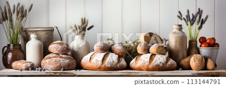 Fresh delicious bread banner on blurred kitchen background with copy space for text 113144791