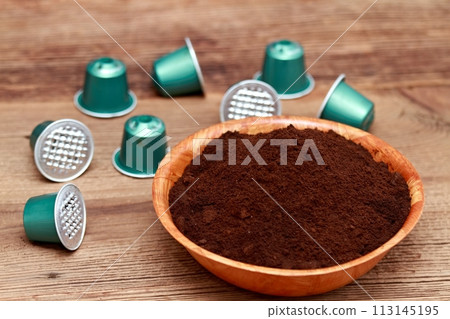 Coffee grounds in a bowl and used capsules as natural organic fertilizer. Coffee grounds in a bowl and used capsules as natural organic fertilizer. 113145195