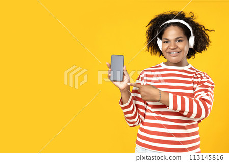 A young African American woman with a smartphone in her hands 113145816