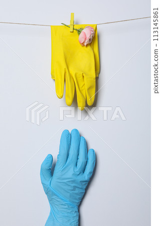 Rubber gloves with flowers on a rope Rubber gloves with flowers on a rope 113145861