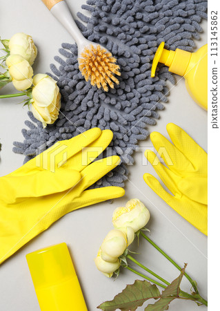 Rubber gloves with flowers, rag and detergents Rubber gloves with flowers, rag and detergents 113145862