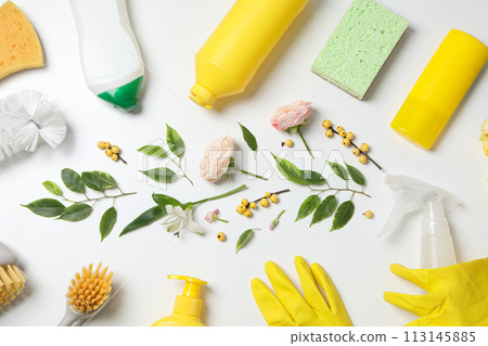Detergents with fresh flowers on a white background Detergents with fresh flowers on a white background 113145885