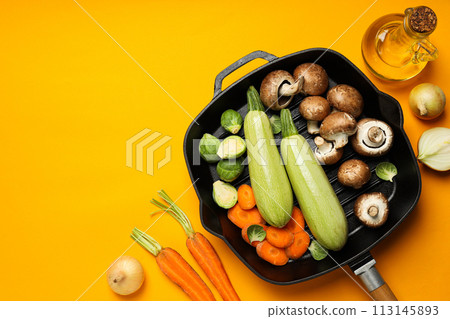 A pan for cooking on the table, with ingredients. 113145893