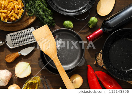 A pan for cooking on the table, with ingredients. A pan for cooking on the table, with ingredients. 113145896
