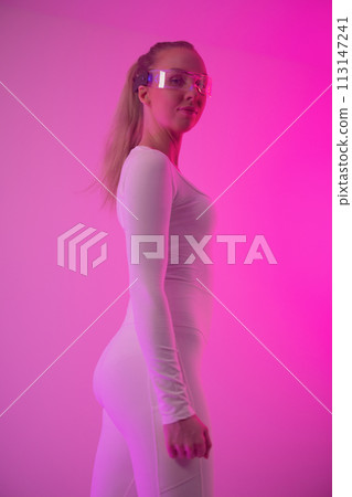 Futuristic Woman in Holographic Glasses with Neon Lights Futuristic Woman in Holographic Glasses with Neon Lights 113147241