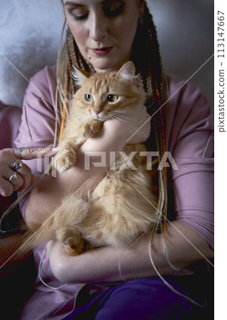 an elderly woman works with laptop at home and show her daughter what she have done 113147667