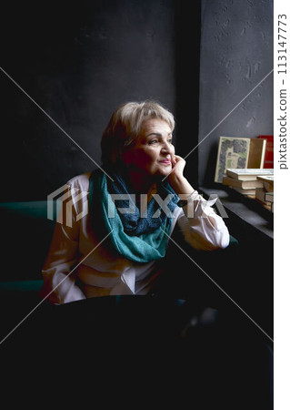 portrait of an old woman in a cafe 113147773